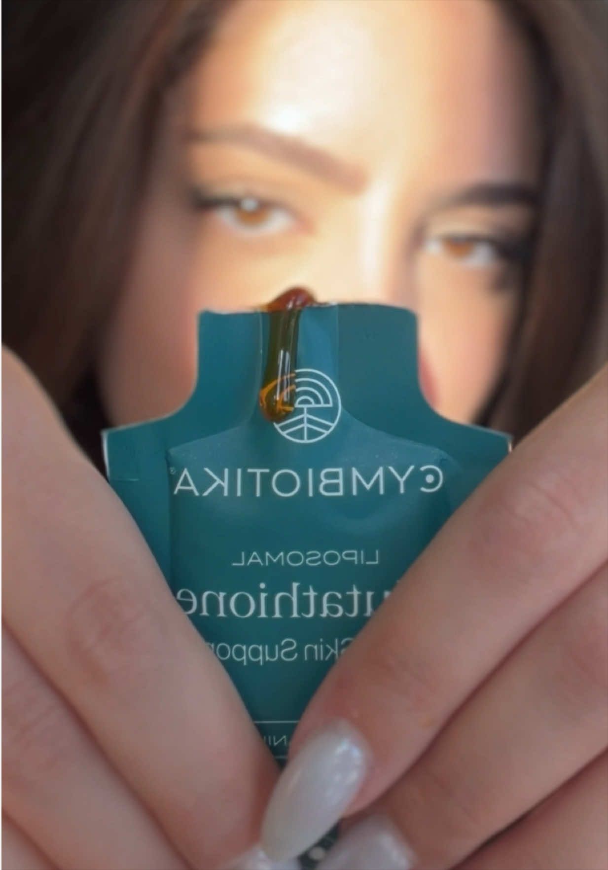 TikTok post by @liliit__ for Cymbiotika. Caption reads: @Cymbiotika I’m so happy I can finally take [...].