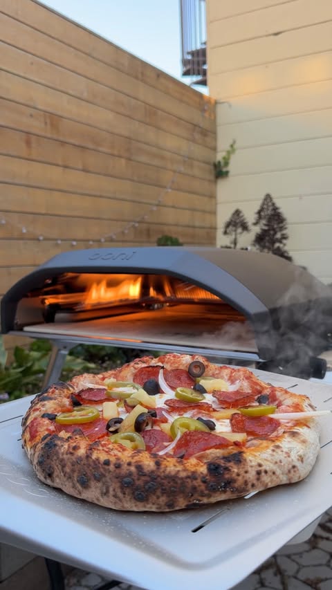 Instagram post by @peggy_shoo for Ooni. Caption reads: [...] an upgrade 🍕🔥 #ad I already love my....