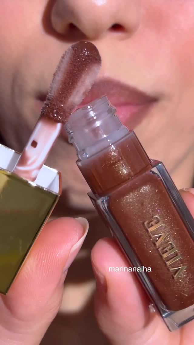 Instagram post by @marinanalha for Space NK. Caption reads: How gorgeous is this lip oil???

Perfect mood for....