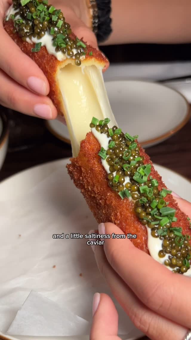 Instagram post by @thequeenfoodie for American Express. Caption reads: We know about the viral caviar mozz stick, but how....