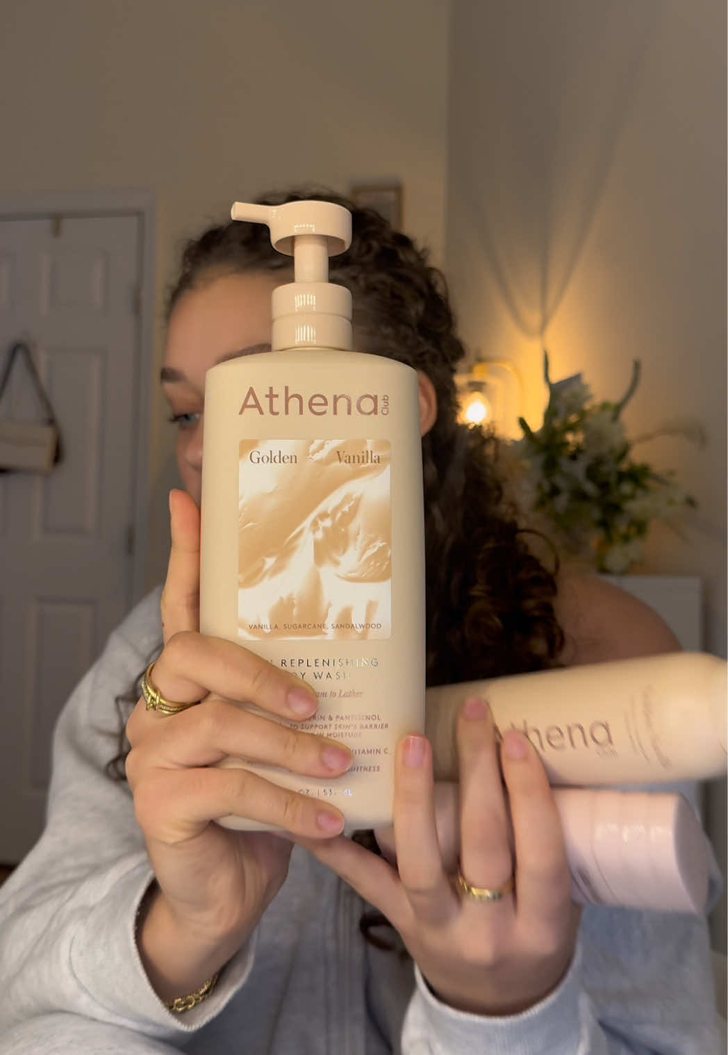 TikTok post by @thatgirlwiththecurlyhair for Athena Club. Caption reads: [...] and smelling delicious all fall long @Athena....