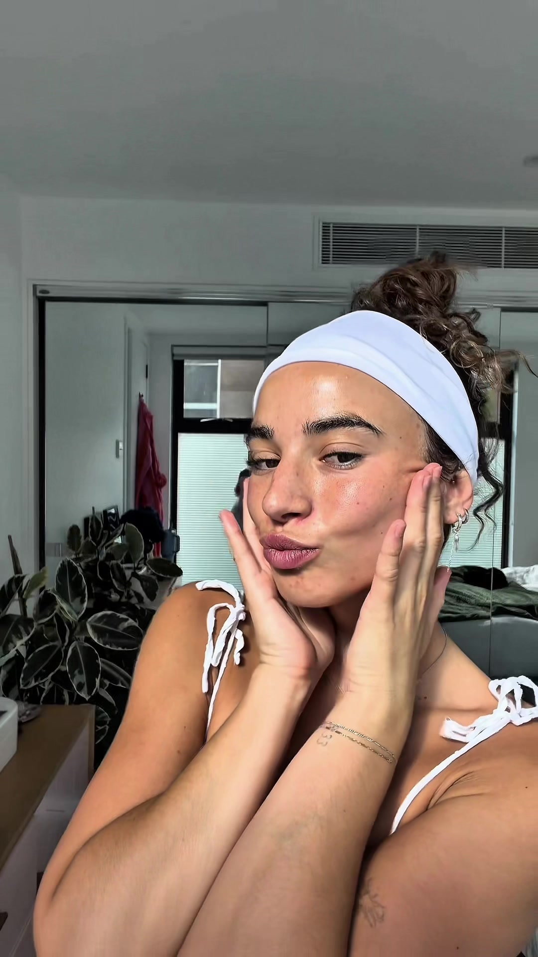 TikTok post by @rileyarmitage_ for Clinique. Caption reads: Letting go of skincare overkill, keeping the glow....