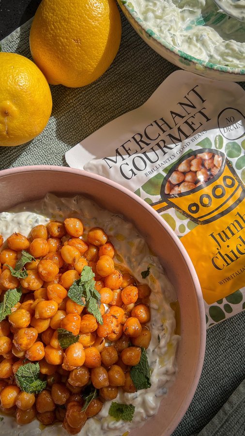 Instagram post by @alwayshungryinlondon for Merchant Gourmet. Caption reads: Spiced Chickpeas with Homemade Tzatziki 
A perfect....