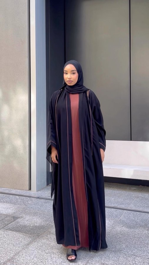 Instagram post by @manalmiaa for Hawaa Clothing. Caption reads: Simplicity is timeless with @hawaa_clothing 🤎.