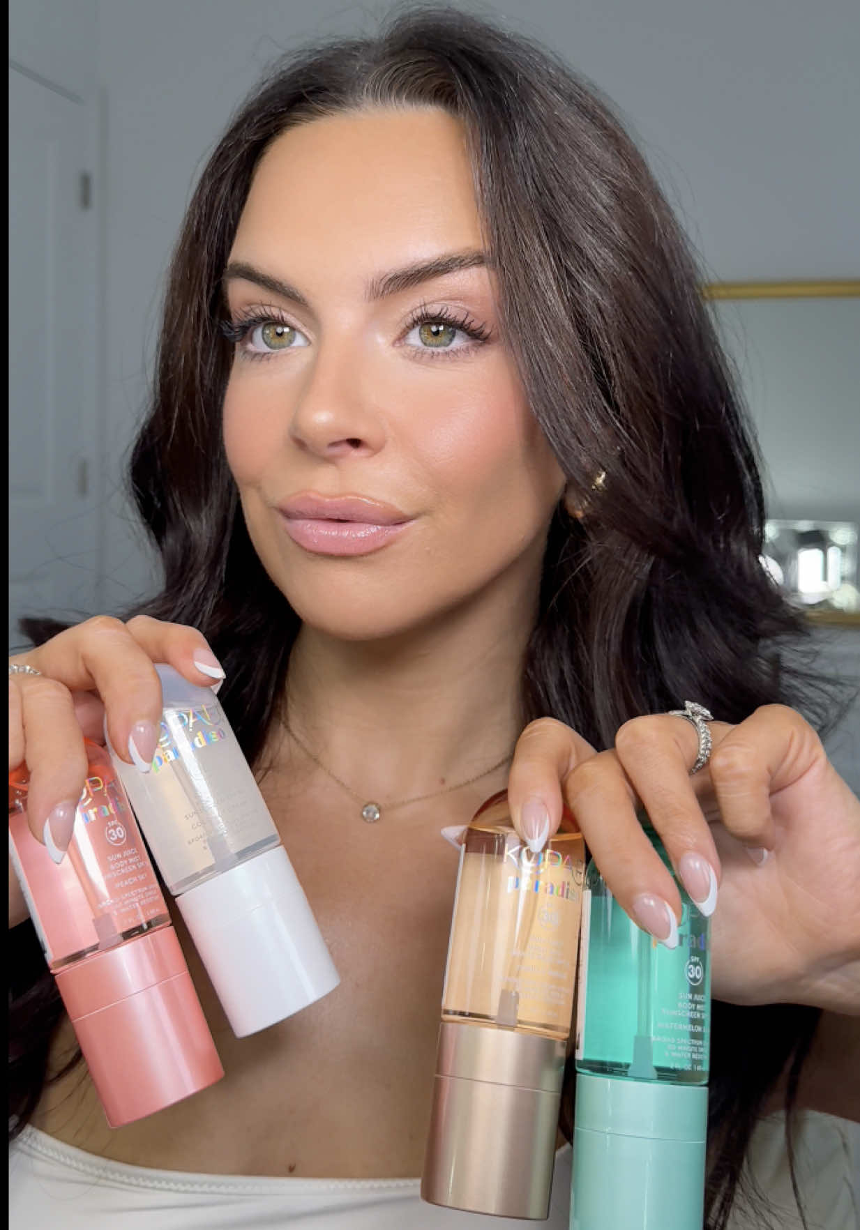 TikTok post by @victoriaengasser for Kopari Beauty. Caption reads: the step I never skip 🤍 sun juice body mists....