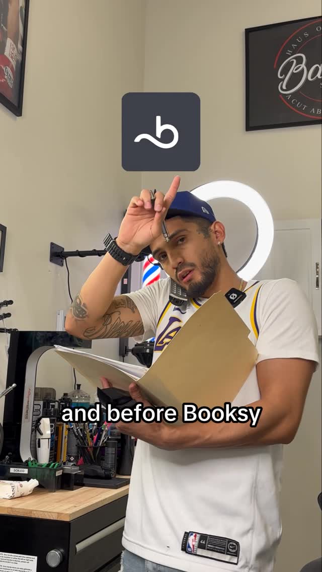 Instagram post by @barberzay_ for Booksy. Caption reads: [...] calls do yourself a Favor and DOWNLOAD....