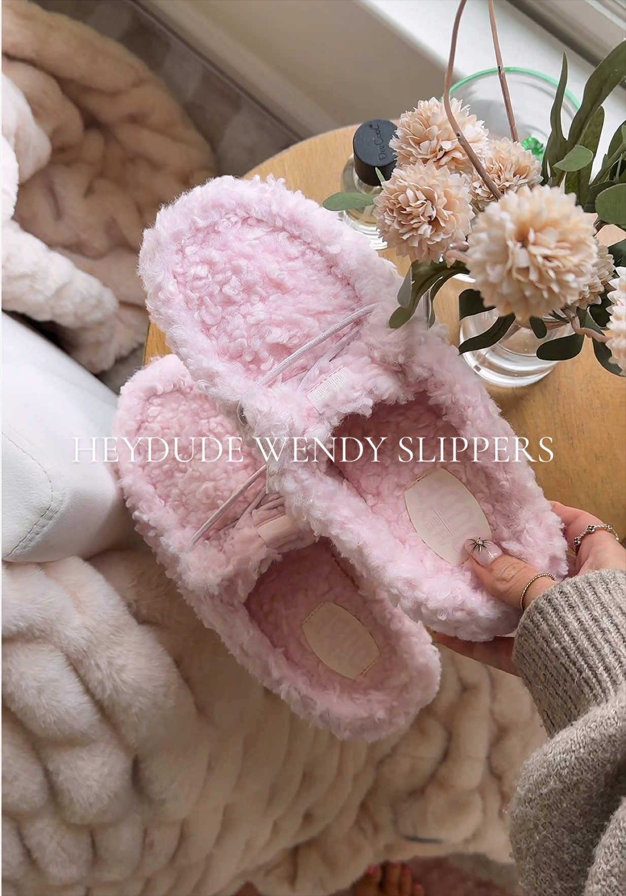 TikTok post by @alygraphs for Hey Dude Shoes. Caption reads: [...] pink and so cozy 🌸🎀✨ @HeyDude....
