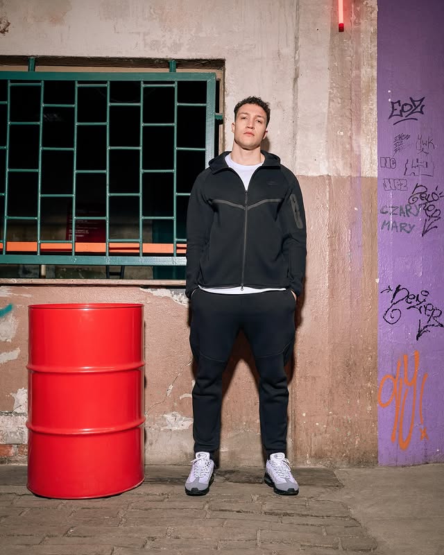 Instagram post by @ajthepolishamerican for JD Sports Poland. Caption reads: Chyba oficjalnie zostałem modelem🫣 Nowa sesja dla....