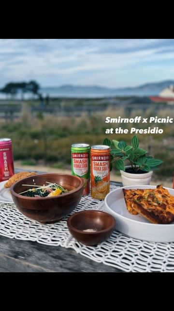 Instagram post by @millielai for Smirnoff. Caption reads: #ad Summer picnics in the Bay Area with the brand....