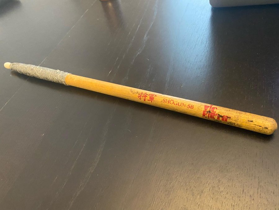 Instagram post by @ash_revocation for Vic Firth. Caption reads: My very first drum stick I ever bought, ever.....