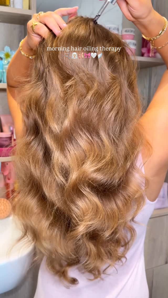 Instagram post by @byemmaleah for L'Oreal Paris. Caption reads: morning hair oiling therapy....