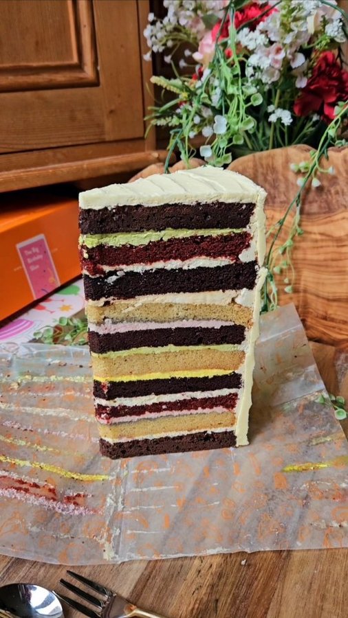 Instagram post by @feastwithjessie for Cutter & Squidge. Caption reads: Yes, it's another layer cake, and this one is....