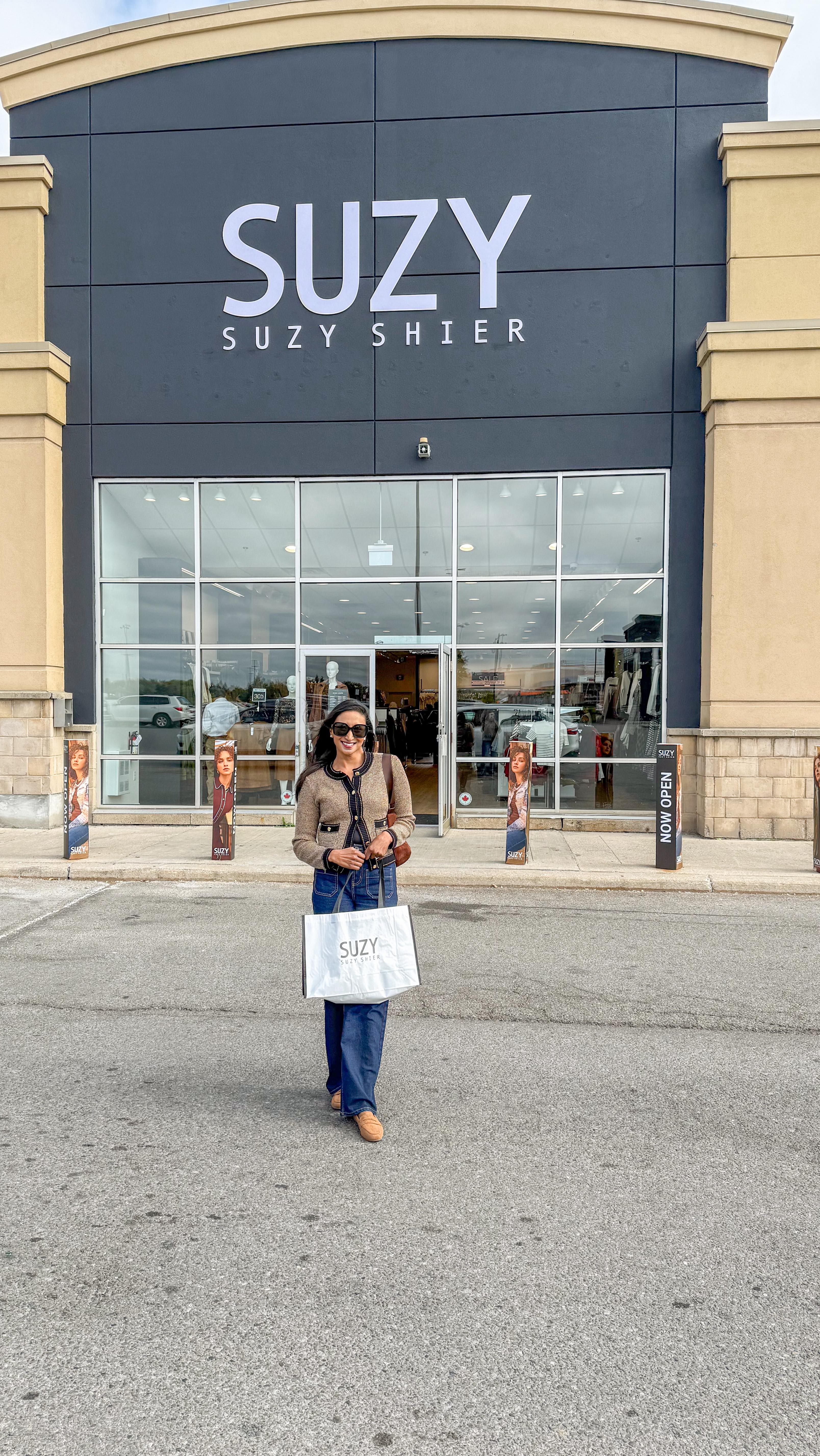 Instagram post by @thewkndfashionista for Suzy Shier. Caption reads: 🎉Suzy Shier is back at Trinity Commons! 

Come....