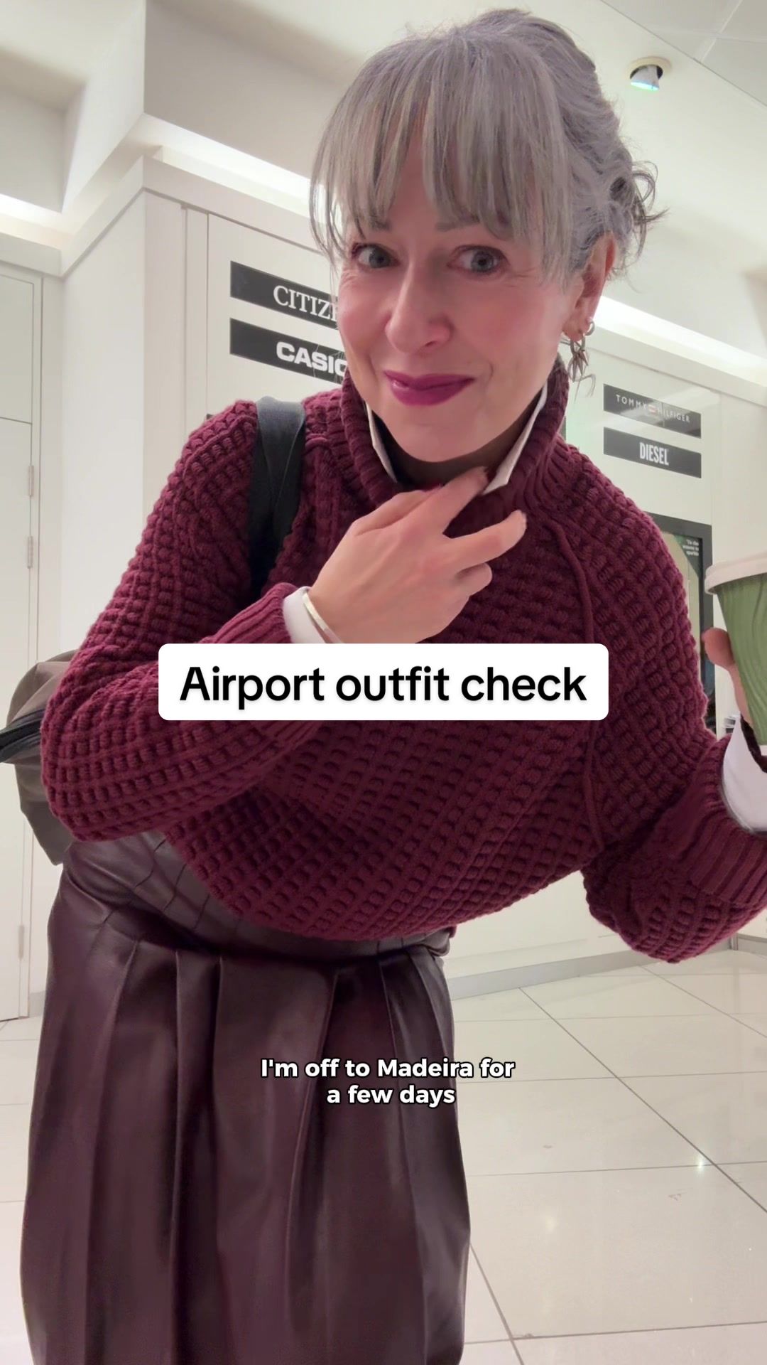 TikTok post by @awomancalledgeorge for French Connection. Caption reads: We haven’t done an airport outfit check for a....