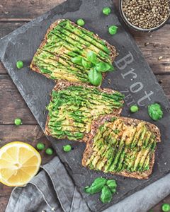Instagram post by @evaburkowsky for THRIVE Magazine. Caption reads: Hands up if you love avocado breads as much as I....