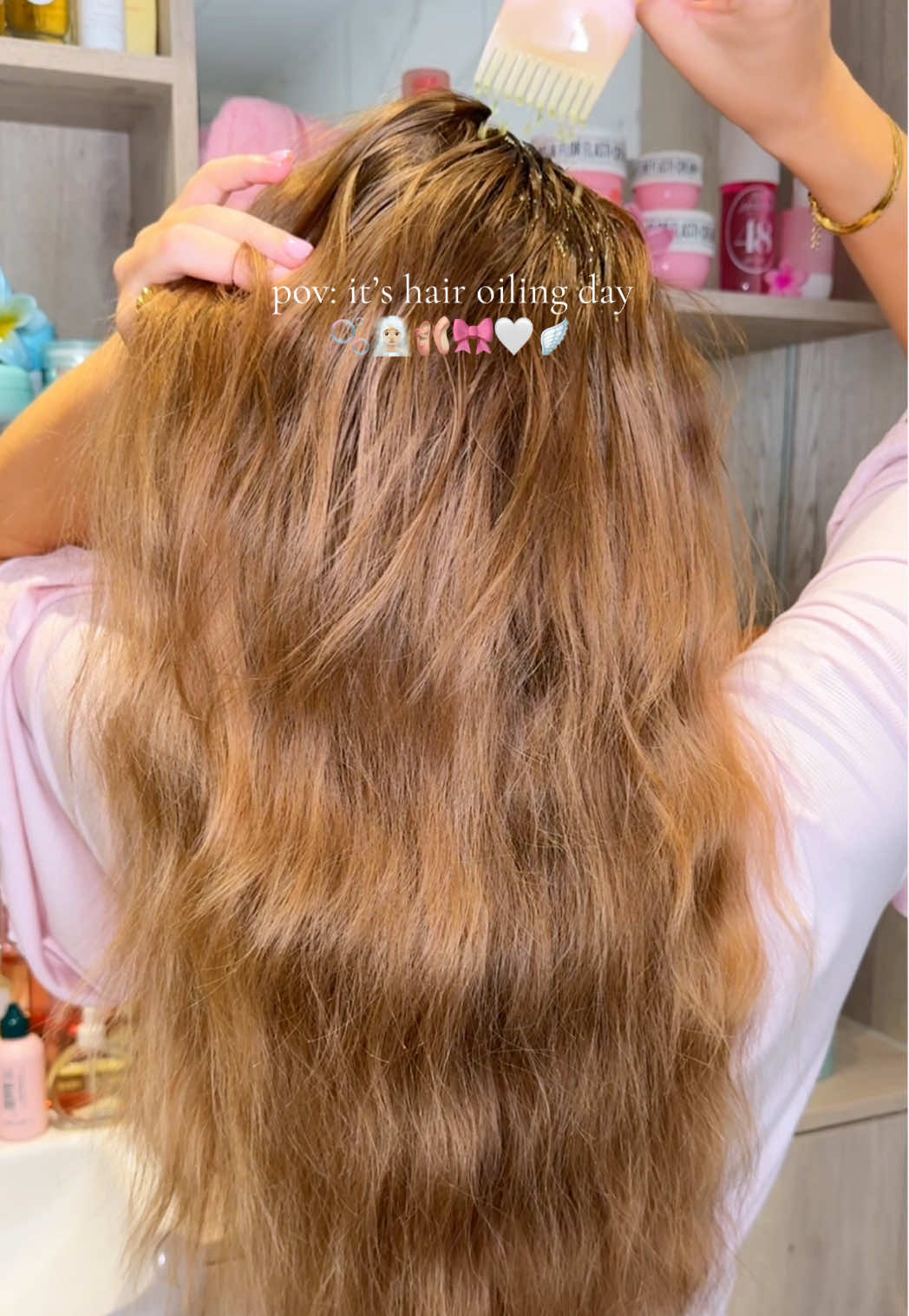 TikTok post by @by.emmaleah for Gisou. Caption reads: [...] @VEGAMOUR gro scalp massager* @Gisou honey....