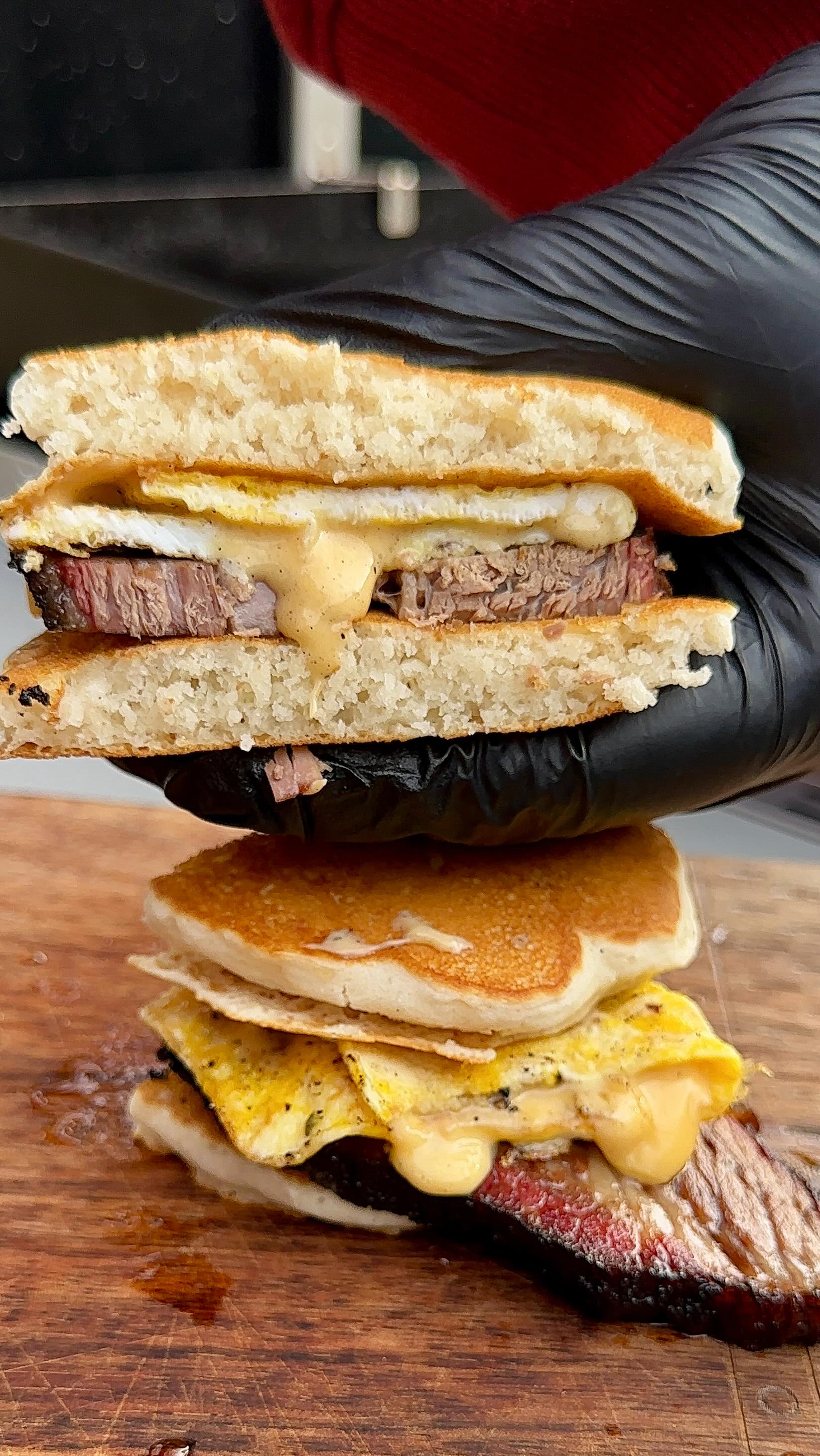 Instagram post by @cookingwithcarrrl for Weber Grills. Caption reads: Brisket > Bacon #BreakfastSandwich #Brisket....