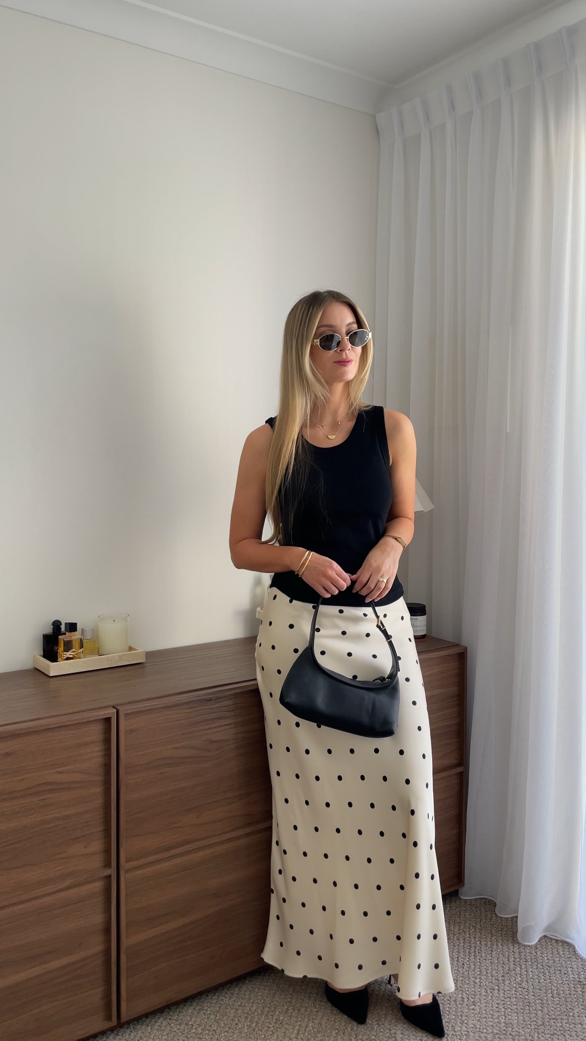 Instagram post by @isabellawears__ for Flo & Frankie. Caption reads: Spring styling made easy with @storiesbetoldlabel....