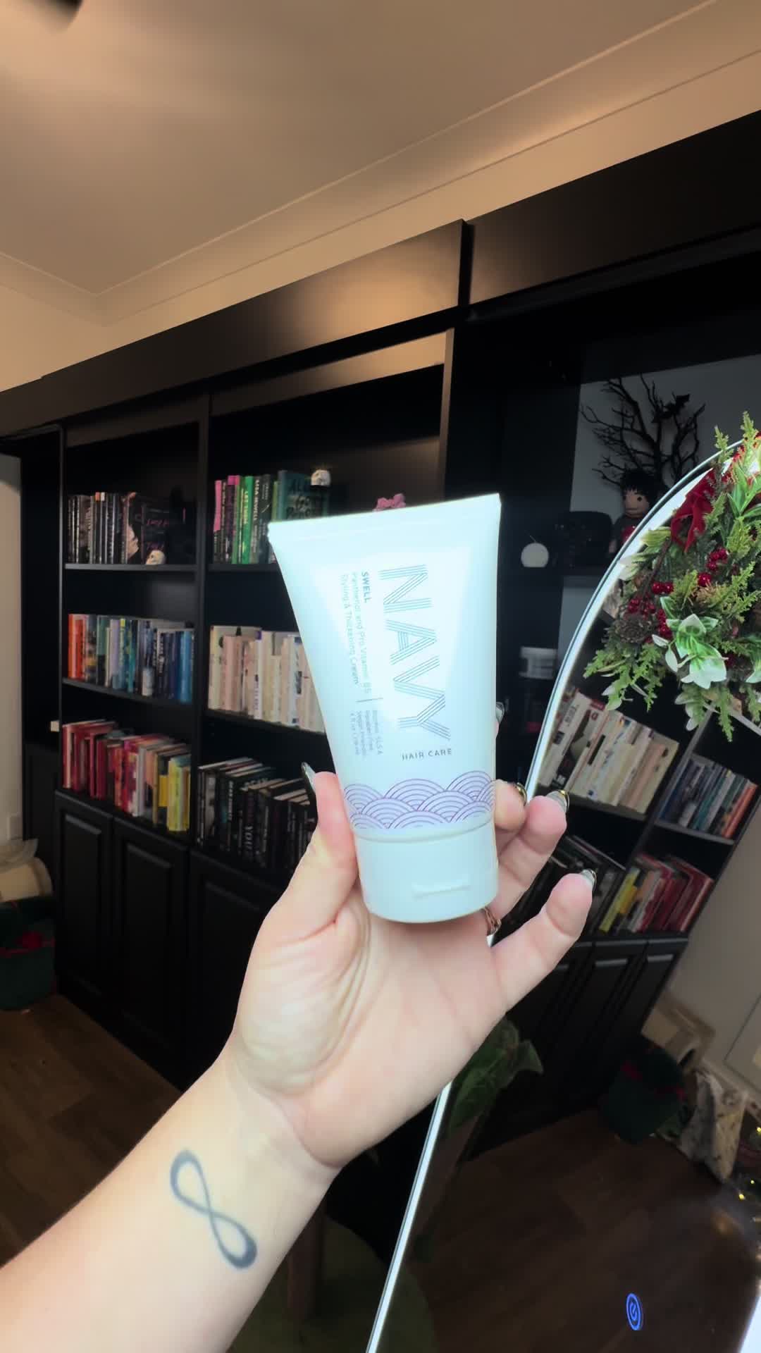 TikTok post by @britneysbamababies for NAVY Hair Care. Caption reads: [...] I’ve been absolutely obsessed with....
