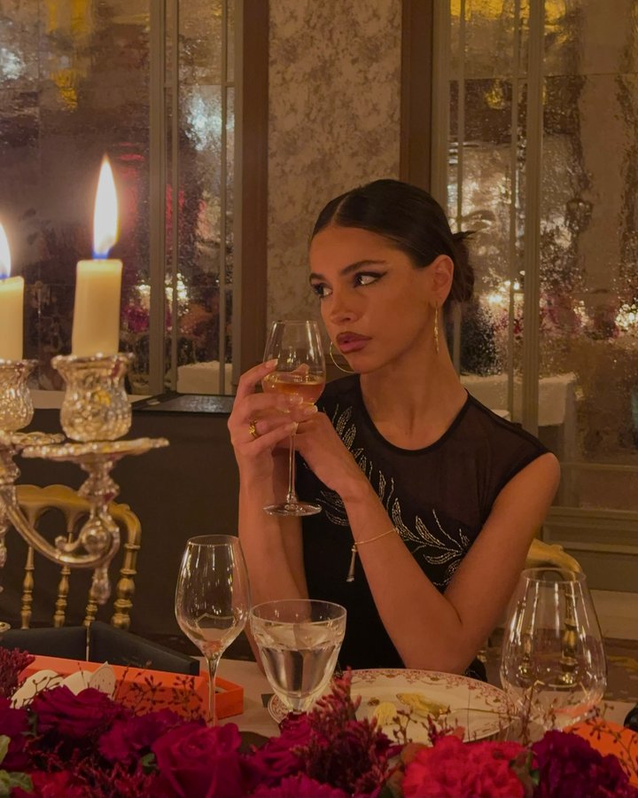 Instagram post by @oliviagrivas for Lipsy London. Caption reads: the sweetest getaway to my favourite city with....