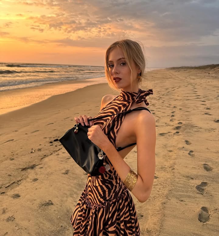 Instagram post by @loretoperalta for Miu Miu. Caption reads: Dreamy holidays 💫 @miumiu 
#MiuMiu #MiuMiuHoliday.