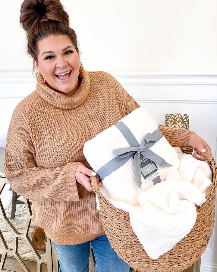Instagram post by @curvestocontour for The Home Edit. Caption reads: RESTOCK ALERT! The $20 Barefoot Dreams blanket....