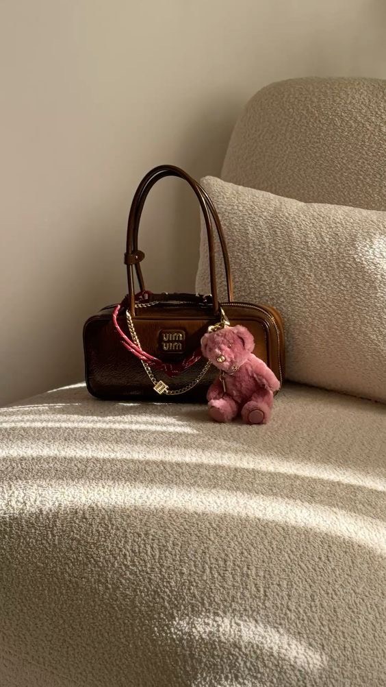 Instagram post by @melanicouronne for Spartoo. Caption reads: 3 must-have coach bags… 🥥 @coach @spartoogram #ad....