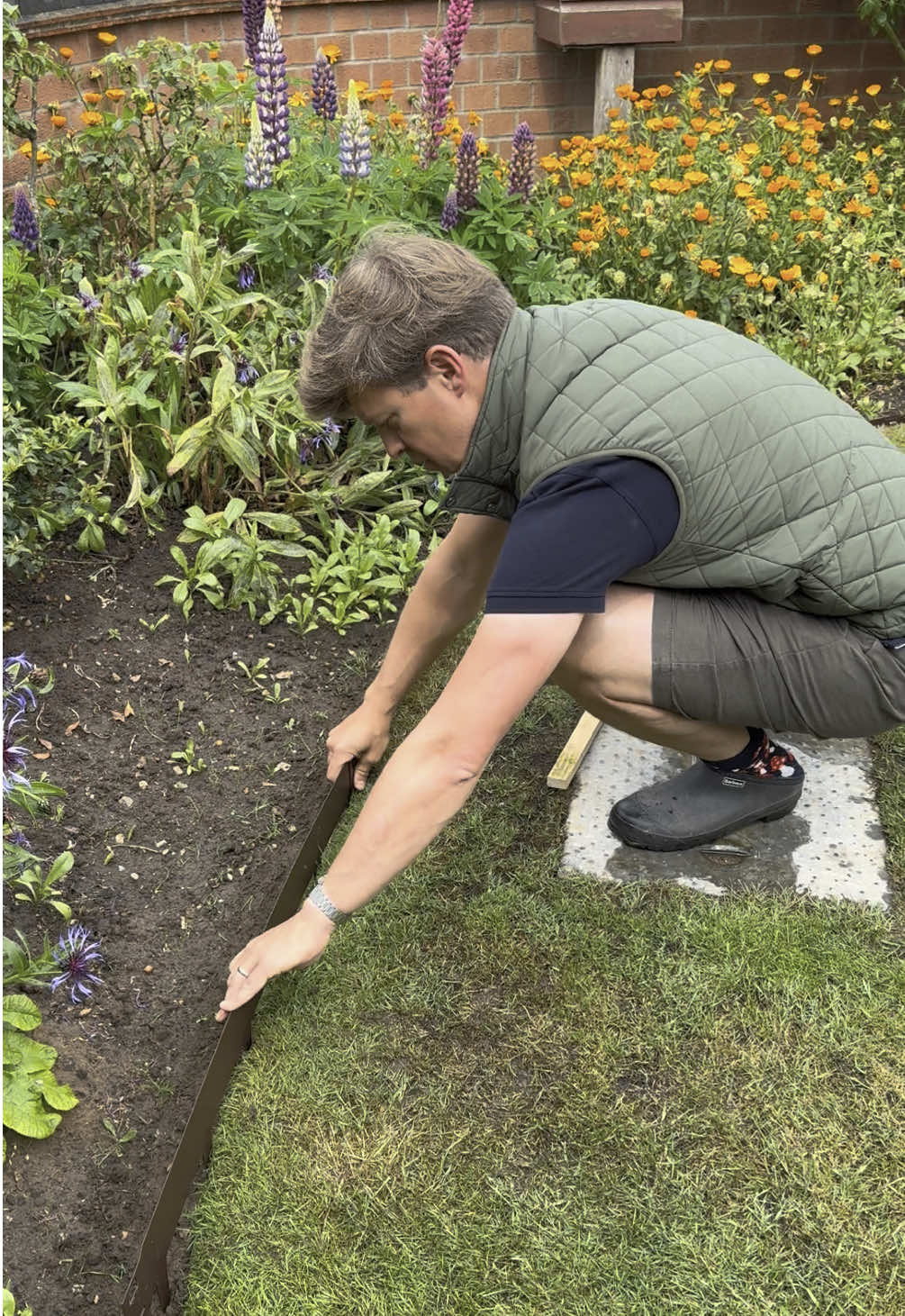 TikTok post by @garden_with_tom for Barbour. Caption reads: Installling Everedge Lawn Edging  One of my....
