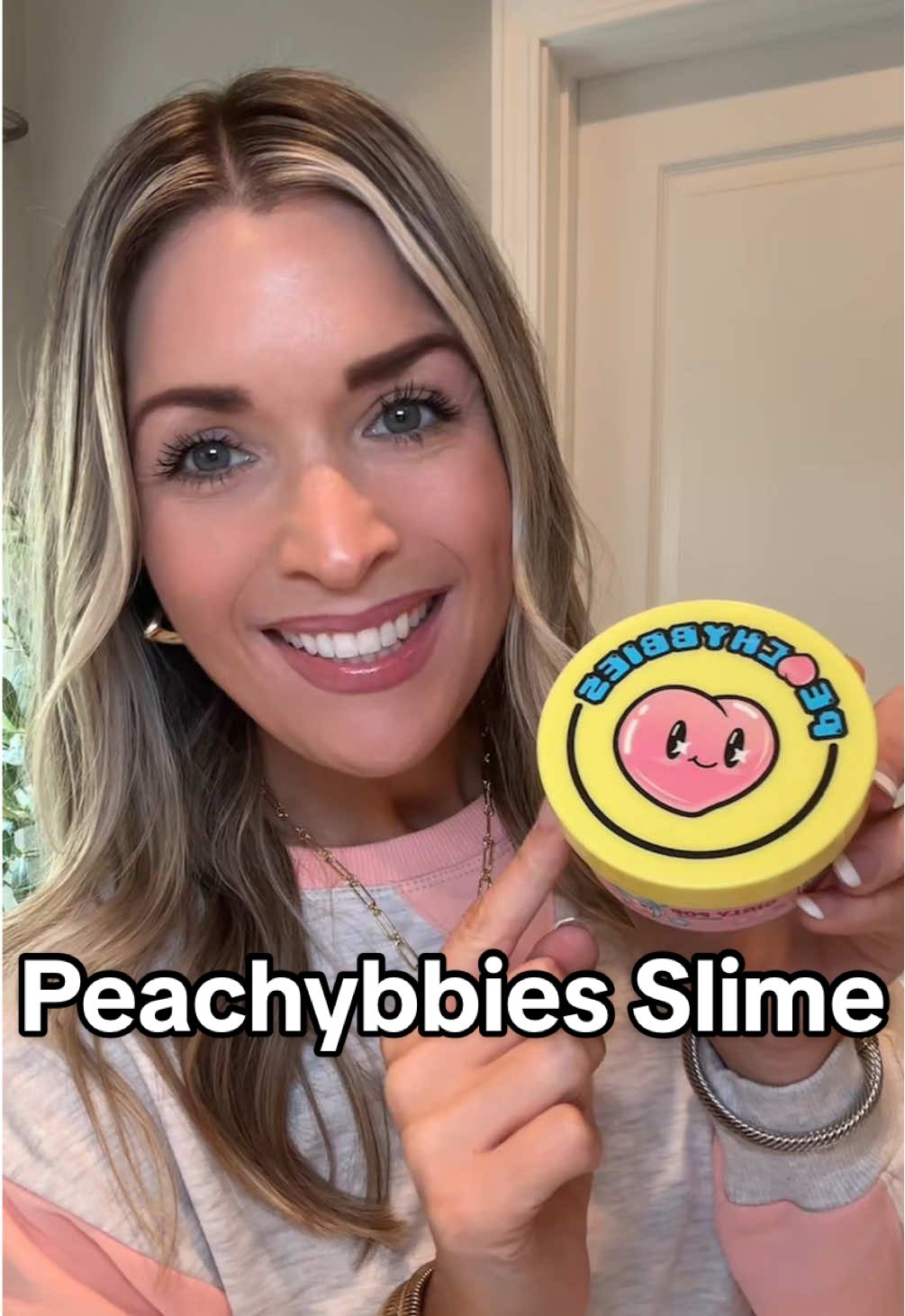 TikTok post by @britney_henderson_ for Peachybbies. Caption reads: Girly Pop @Peachybbies Slime! 🍑🩷📱🍭....