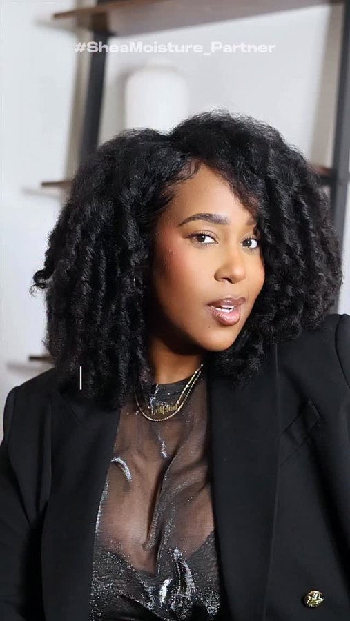 Instagram post by @itsraynacamille for Sheamoisture. Caption reads: The 2011 perm rod @sheamoisture loving Rayna would....