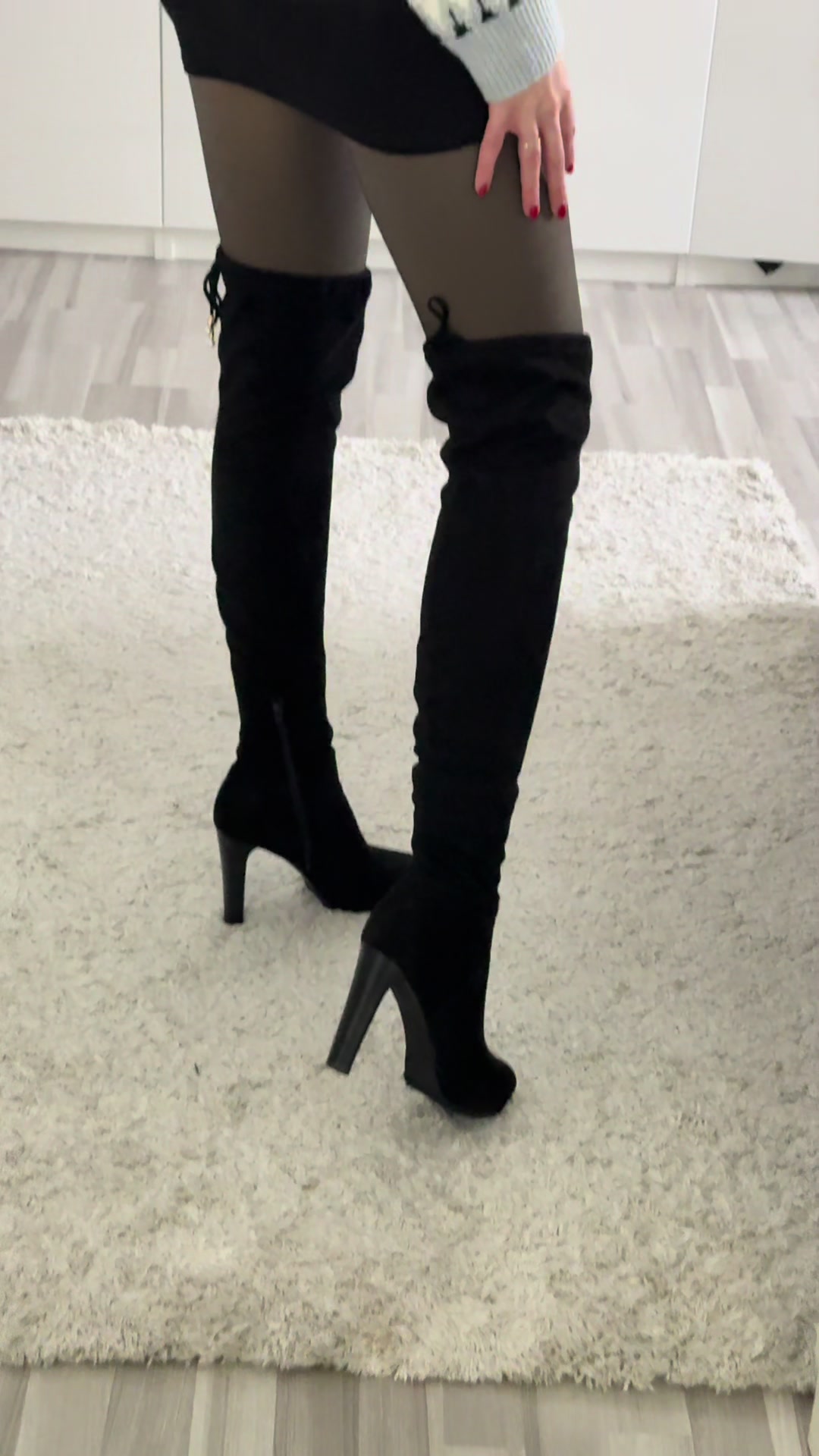 TikTok post by @ida.mina.video for idealofsweden. Caption reads: Yes or no? 🖤 #overkneeboots #miniskirt #tights....