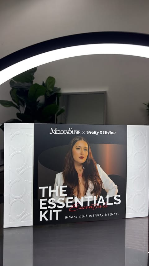 Instagram post by @prettyndivine for MelodySusie. Caption reads: The Essentials Kit is LIVE — where nail artistry....