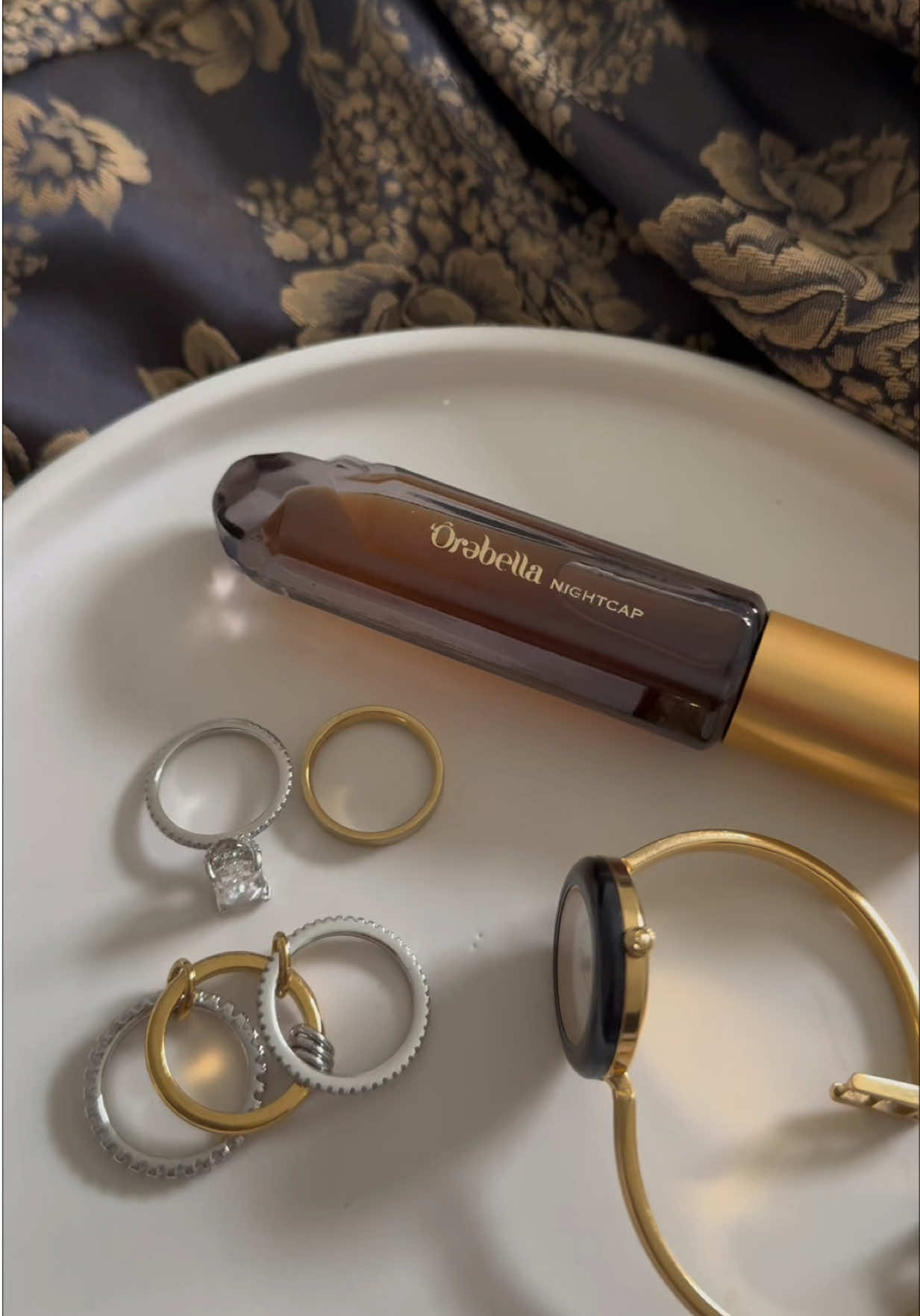 TikTok post by @trishaortiz_ for Orebella. Caption reads: gifted by orebella✨ NIGHTCAP is my new go-to warm....