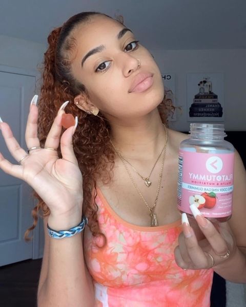 Instagram post by @kk.myloveenazir for Flat Tummy Co. Caption reads: #ad @flattummyco’s Apple Cider Vinegar gummies....