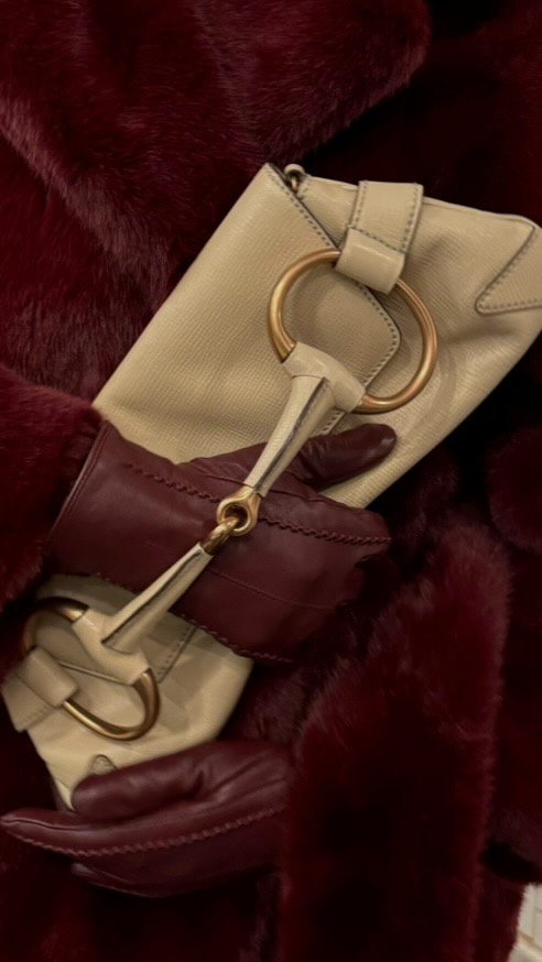 Instagram post by @rosee.lola for Schutz. Caption reads: [...] boots were made for the holidays ❤️ @schutz....