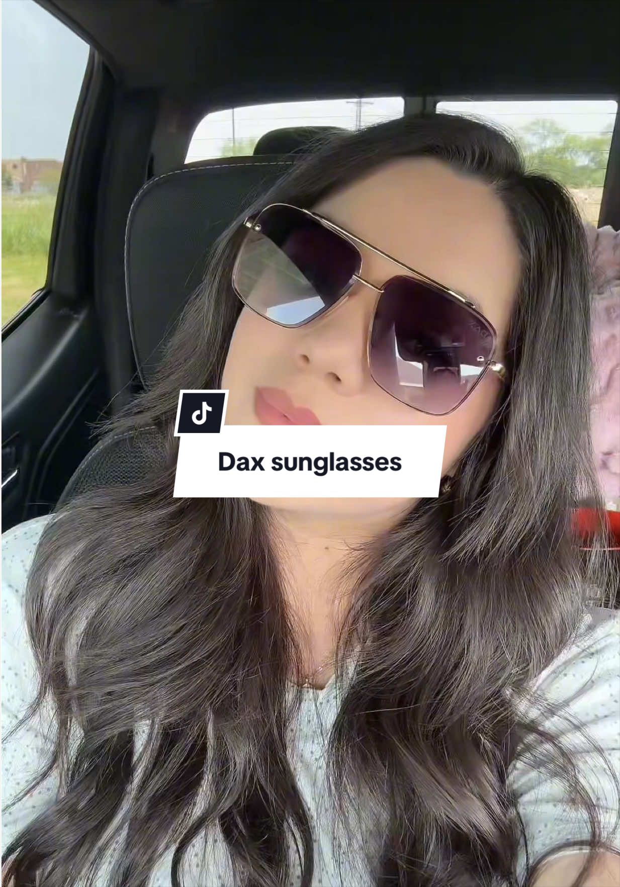 TikTok post by @abbyannmata for Dax Eyewear. Caption reads: [...] they don’t get tangled in my hair! 😍 @Dax....