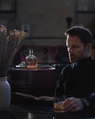 Instagram post by @kosmaskoumianos for Woodford Reserve. Caption reads: On Wednesdays I mix art with science. Going the....