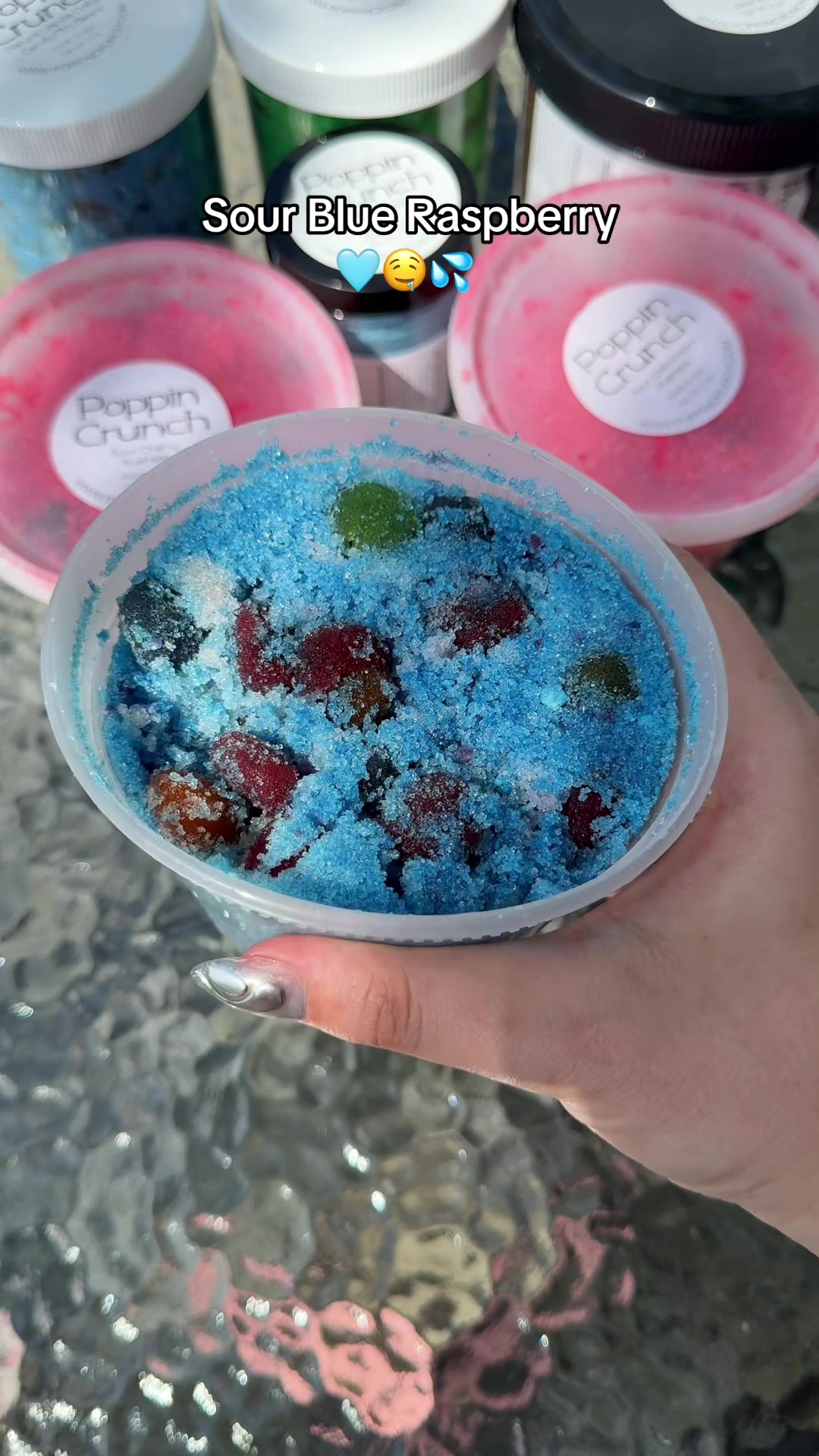 TikTok post by @phoebelishous for Poppin Crunch. Caption reads: my fav sour and sweet treat 😋 @PoppinCrunch....