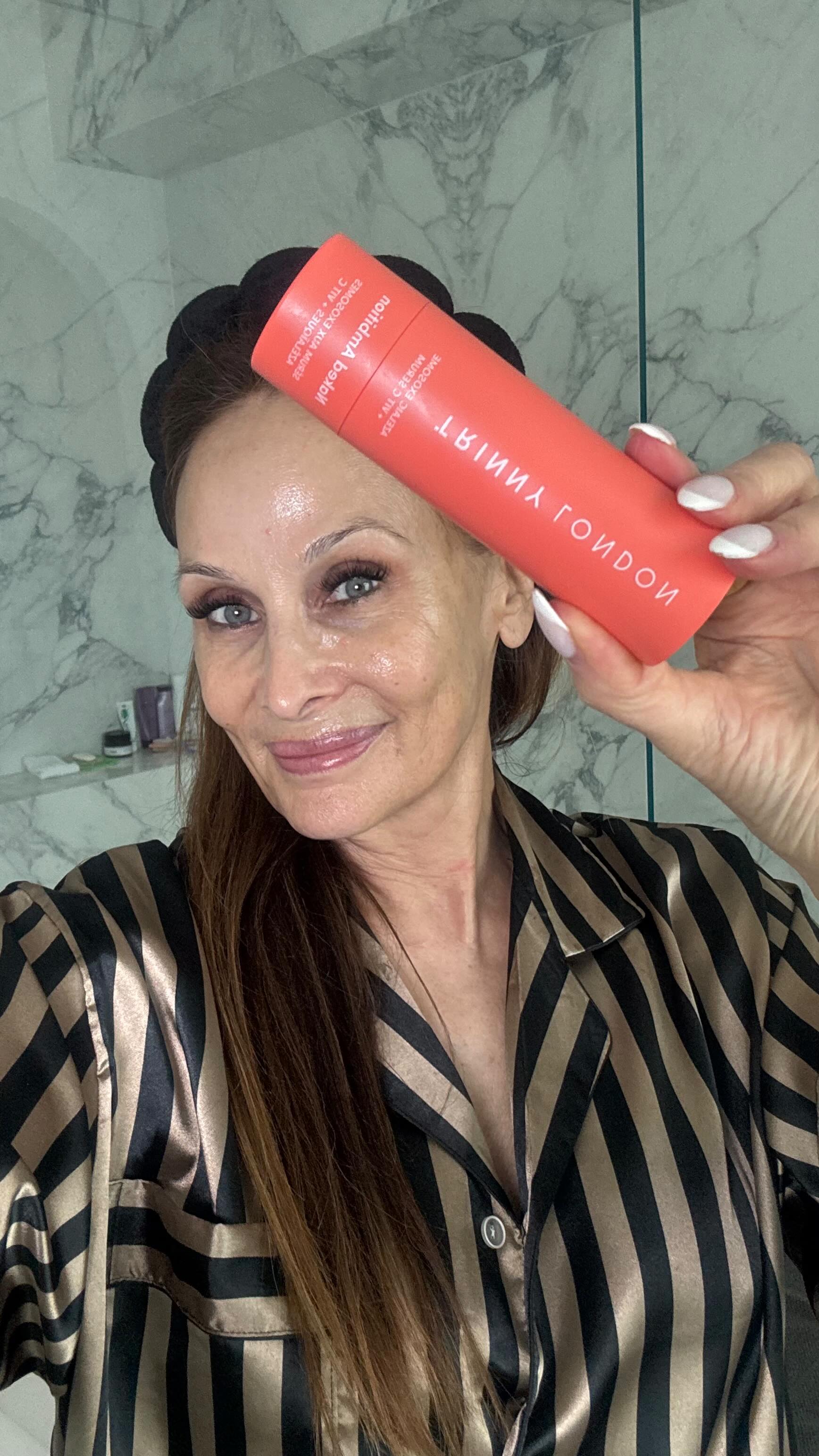 Instagram post by @beautybyelan for Trinny London. Caption reads: Unleashing my inner glow with @trinnylondon Naked....