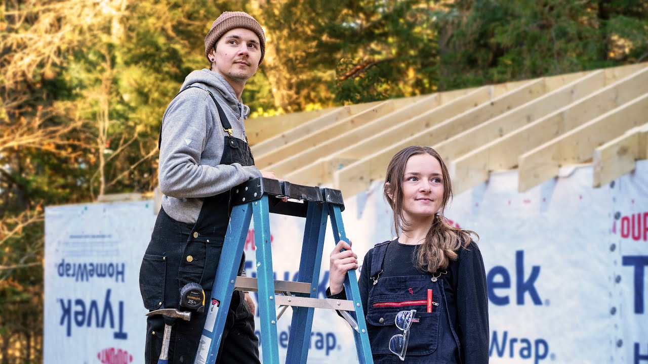 YouTube post by @colinandpaige for Vessi. Caption reads: Ripping Apart Our Off-Grid Cabin in the Woods....