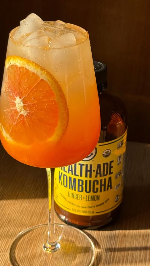 Instagram post by @glowwithella for Health-Ade Kombucha. Caption reads: Persimmon Cardamom & Ginger Spritz

Using....