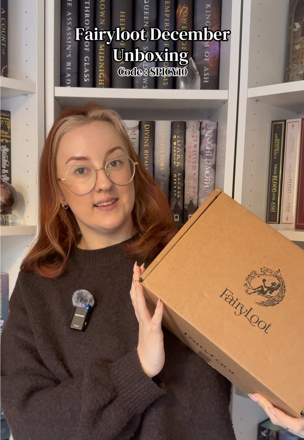 TikTok post by @acourtofspicybooks for FairyLoot. Caption reads: Let’s unbox my December @FairyLoot  box  AD | I’m....