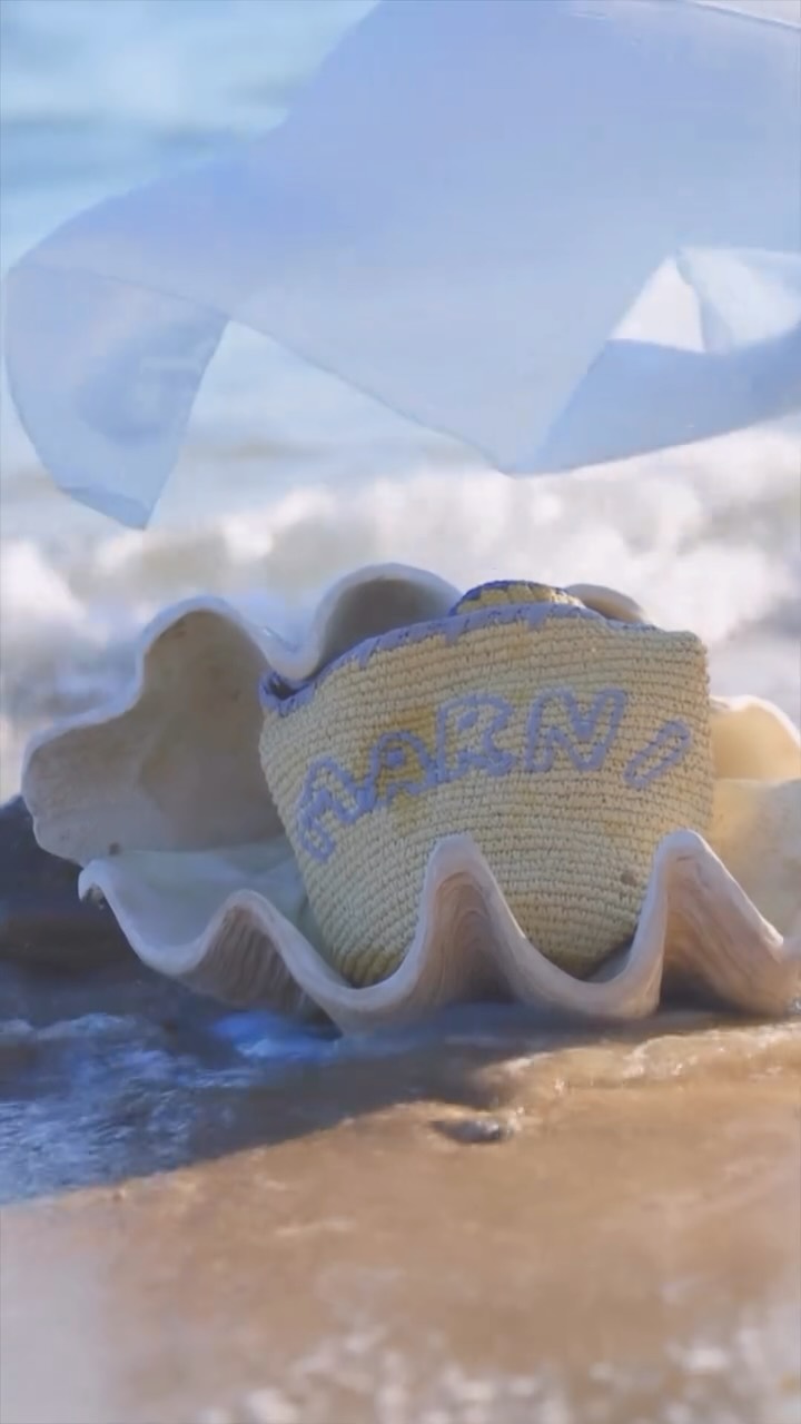 Instagram post by @gizemsahin.official for Marni. Caption reads: Lost in a @marni daydream. 💭🤍

#marni #marnibag....