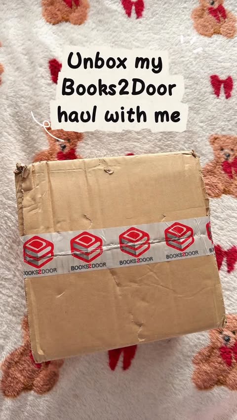 Instagram post by @abbeigh.reads for Books2Door. Caption reads: [ad] Unbox my @books2dooruk haul with me 📚♥️
✨....