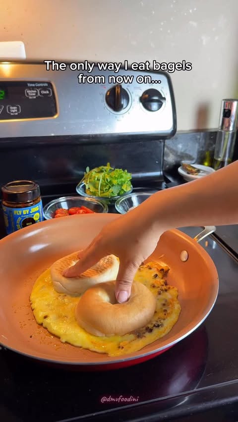 Instagram post by @askmims for FLY BY JING. Caption reads: [...] Crisp Bagel Ingredients: Fly By Jing Mild....