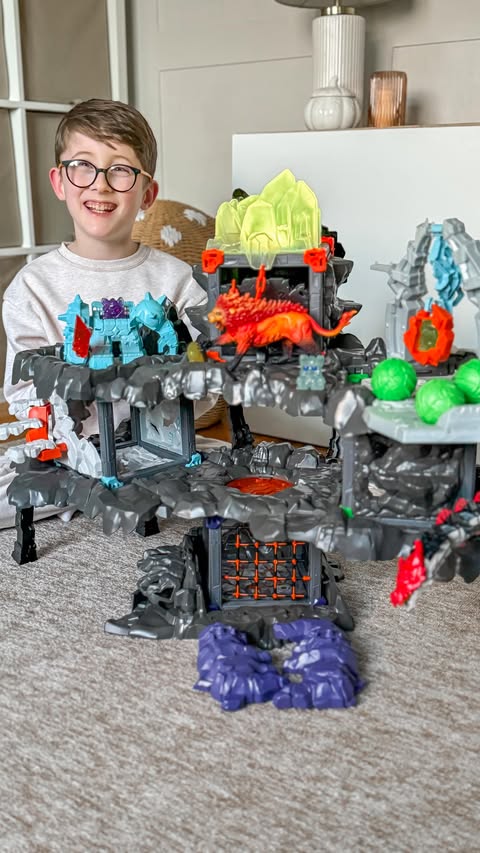 Instagram post by @raising._.boys for Schleich. Caption reads: ad | The MasterCave from @schleich.uk is the most....