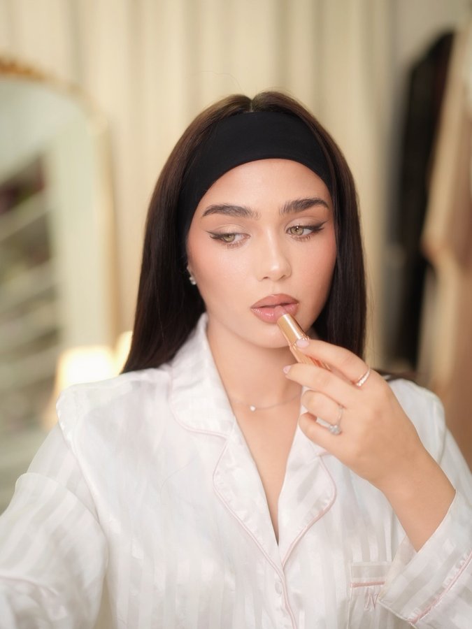 Instagram post by @eyaofficial__ for Charlotte Tilbury. Caption reads: Effortless elegance with a touch of Charlotte.”....