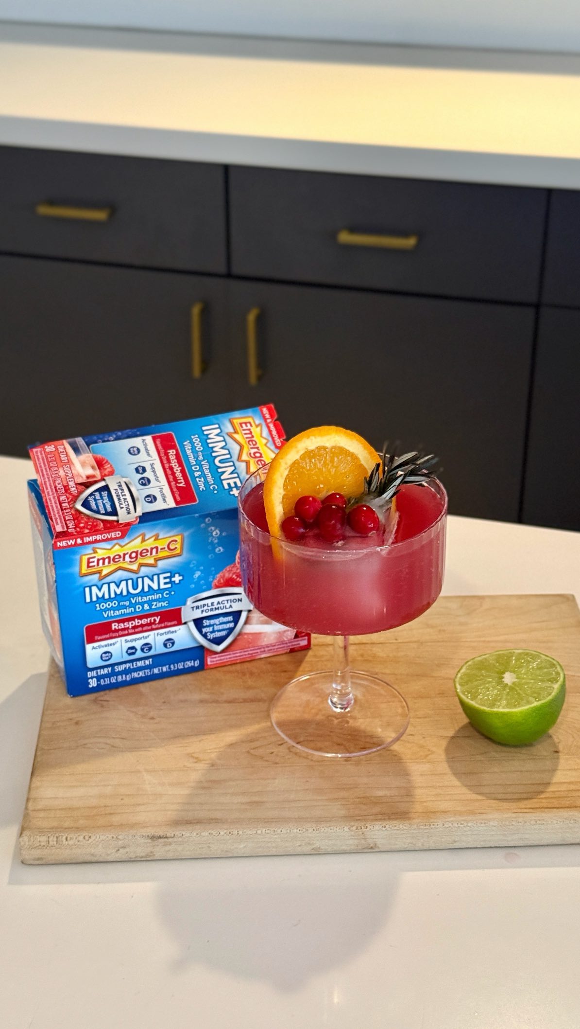 Instagram post by @mackenziedudzik for Emergen-C. Caption reads: #ad Holiday mocktails just got a glow-up ✨🍊 Made....