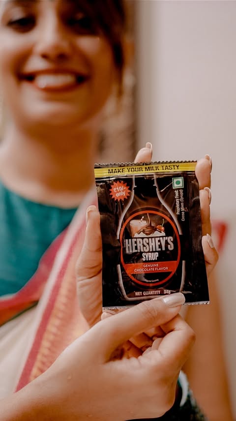 Instagram post by @anilageorgez for HERSHEY'S Chocolate. Caption reads: A full Onam Sadhya and a little room for something....