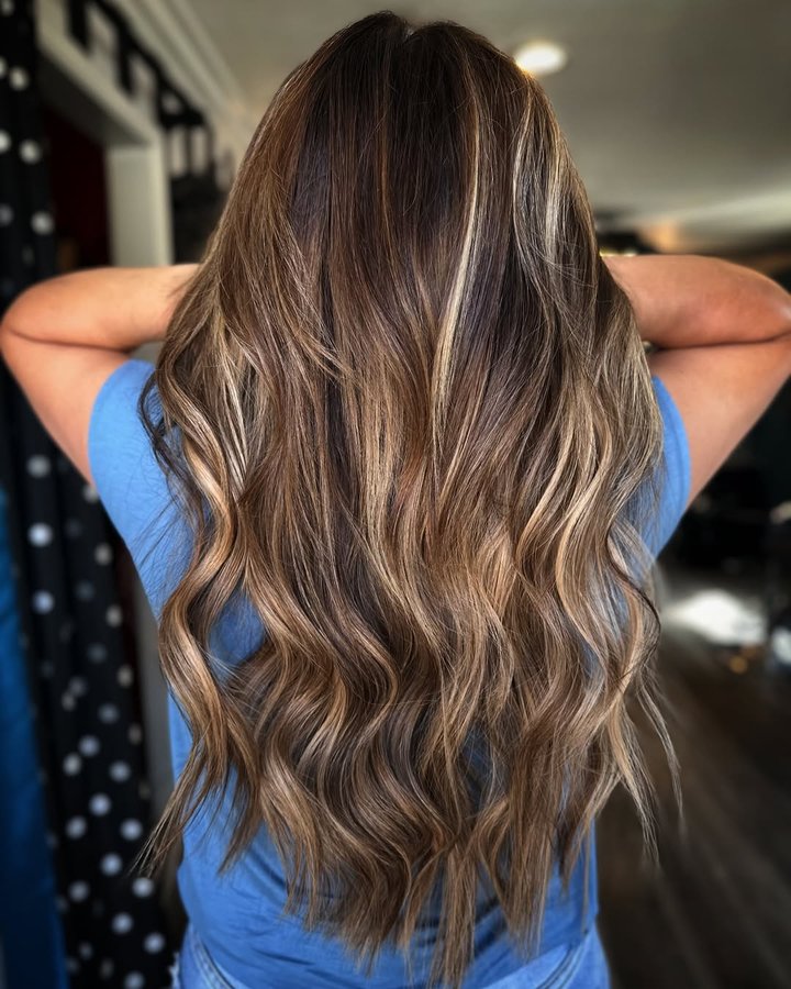 Instagram post by @michellezabattathestylist for Christian Michael Hair Extensions. Caption reads: [...] sister to snag 6 hand tied....